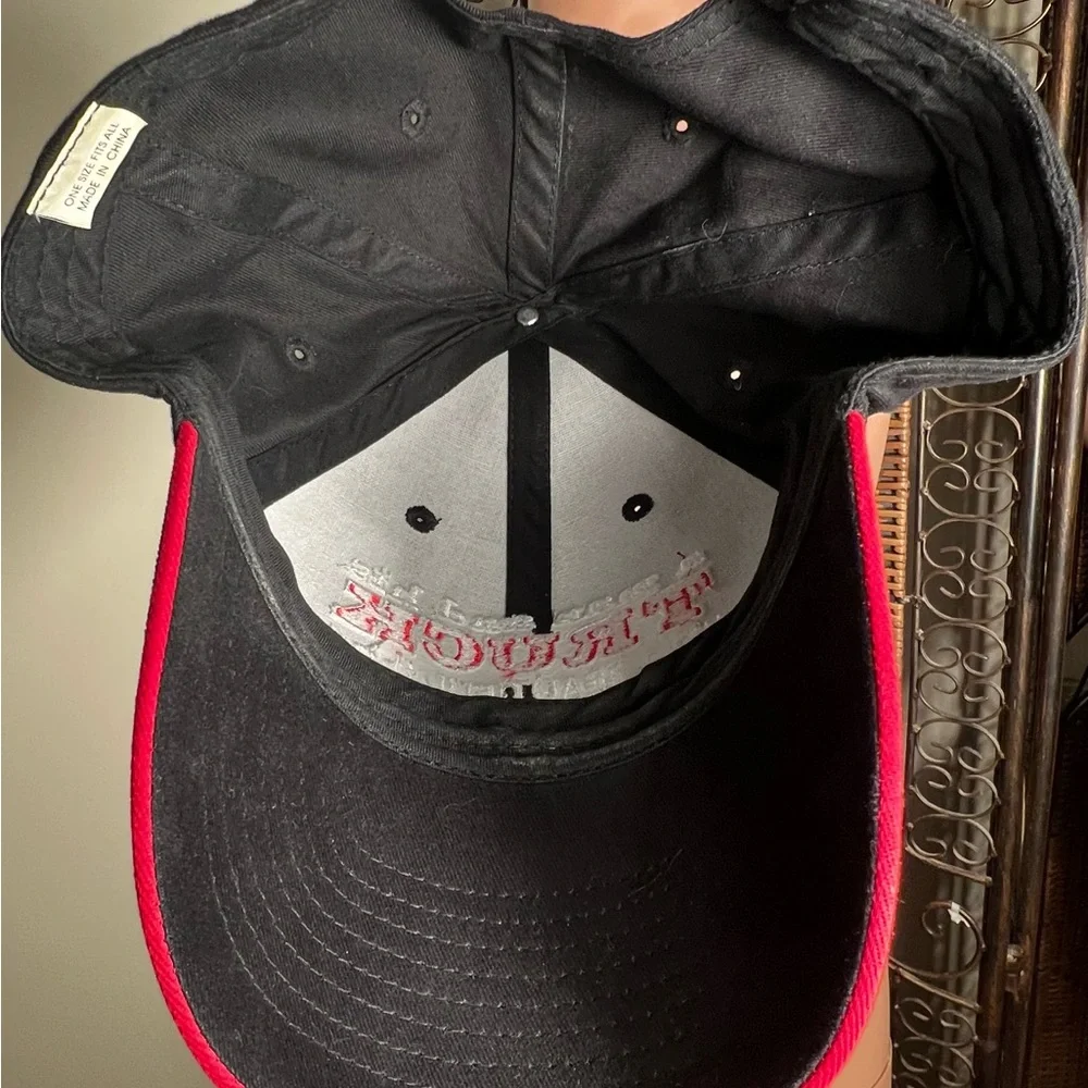 A one size fits all Black ball Cap 